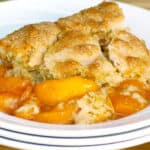 August 12 - 2018 newsletter image of homemade peach cobbler in a white dish