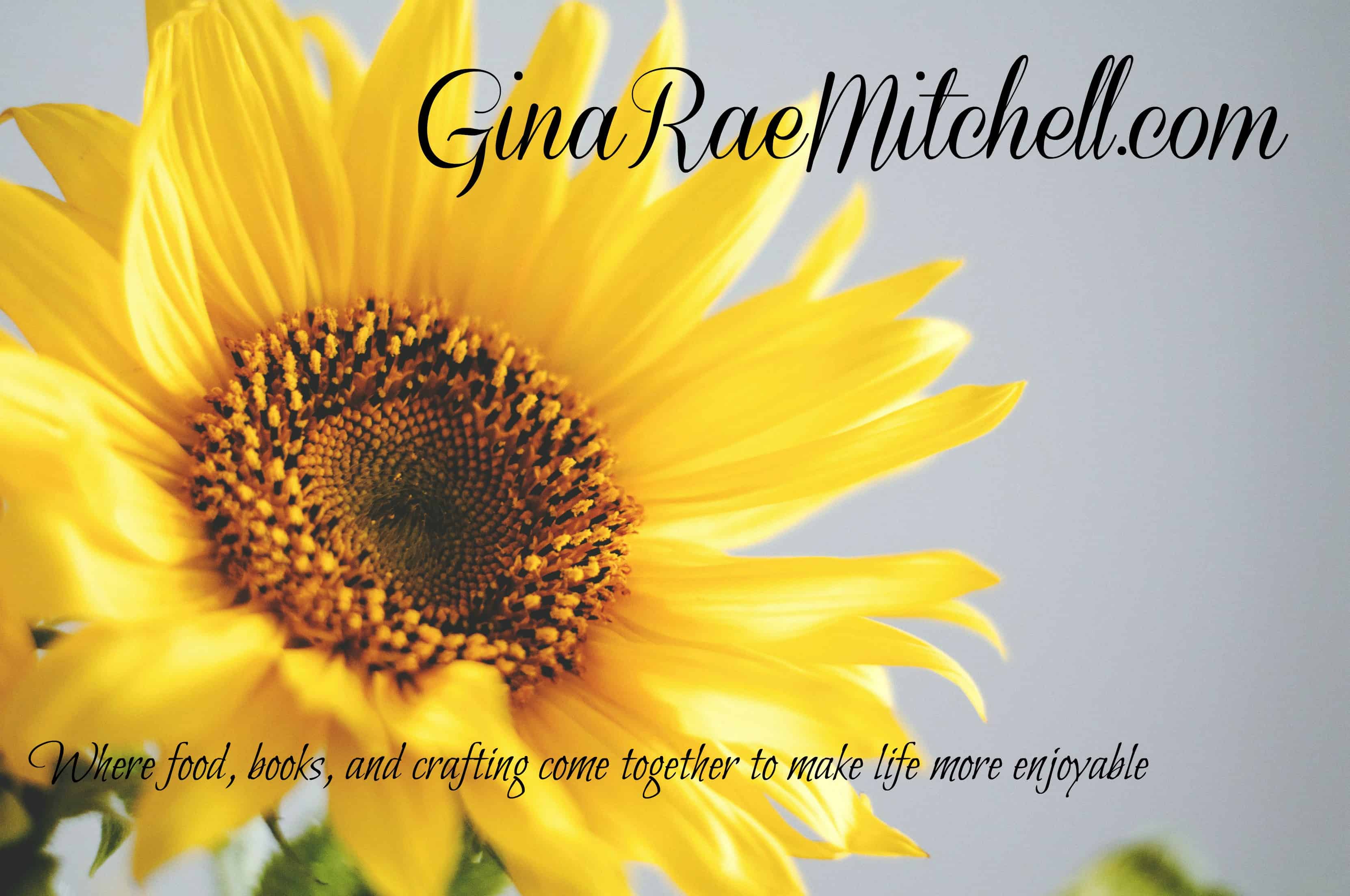 August 12 - 2018 newsletter yellow sunflower on blue sky background with phrase GinaRaeMitchell.com Where food, books, and crafting come together to make life more enjoyable