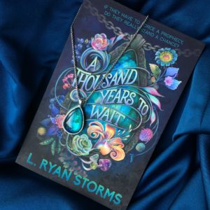 Review a thousand years to wait - book cover on blue cloth with green pendant