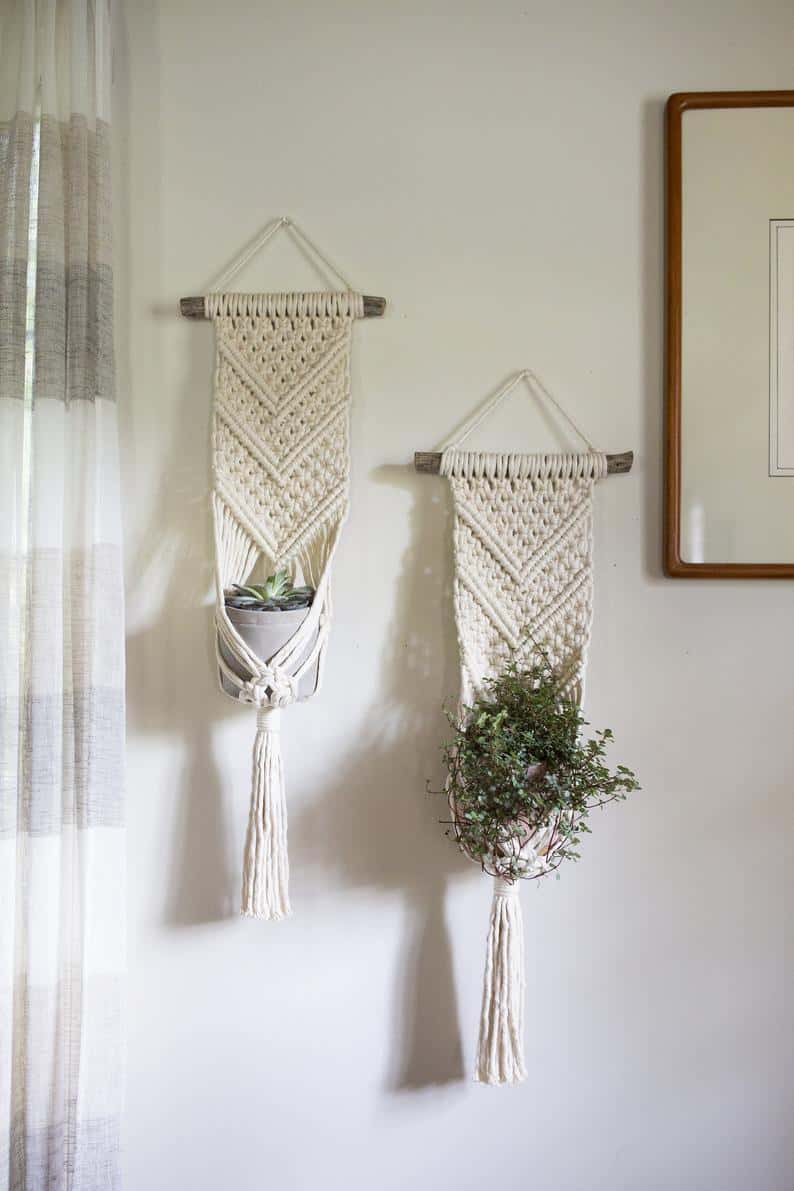 Macrame plant holders on a wall made with driftwood & white cord. Friday Finds Roundup | July 10, 2020