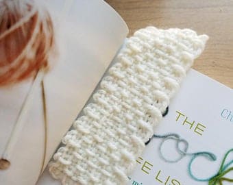handwoven bookmark made with soft yarn on a small loom, perfect for cozy reading