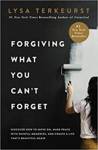 Forgiving what you can't forget by Lysa TerKeurst book cover imamge girl painting over a wall