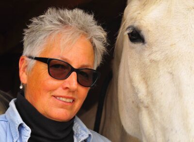 Anna Blake Author image with horse