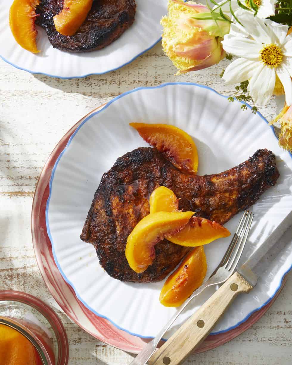whole-pickled-peaches-with-grilled-pork-chops country living
