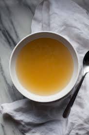 white bowl or cup of chicken stock