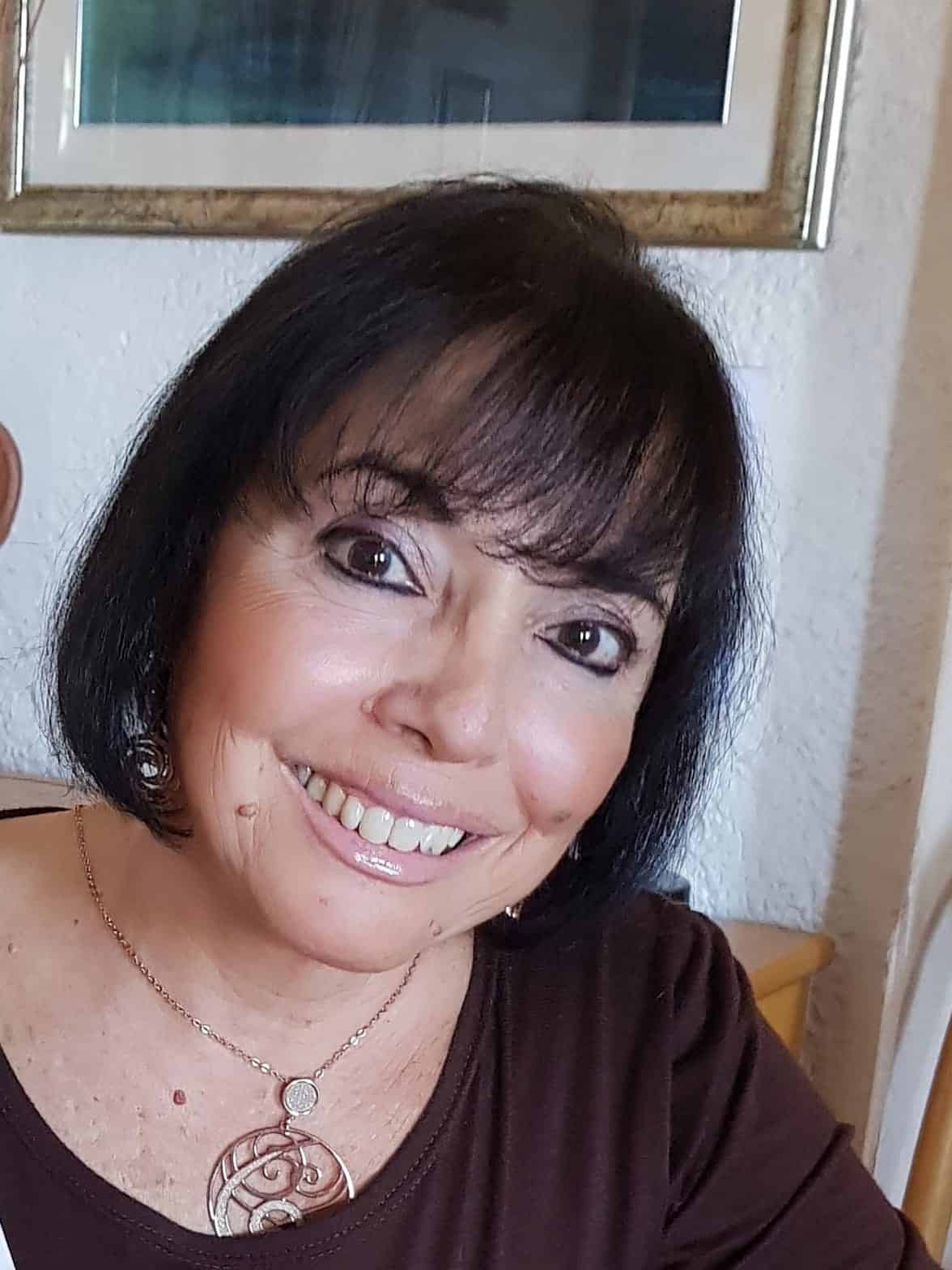 Author photo of Daniela Alibrandi smiling in natural light.