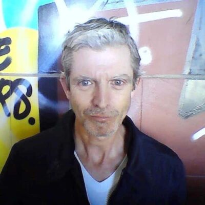 David A. Anderson Author image Black jacket over a t-shirt staring straight at the camera