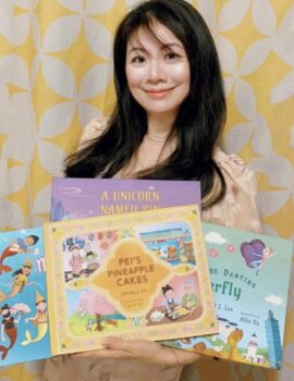 Author Crystal Z. Lee holding all four of her children's books