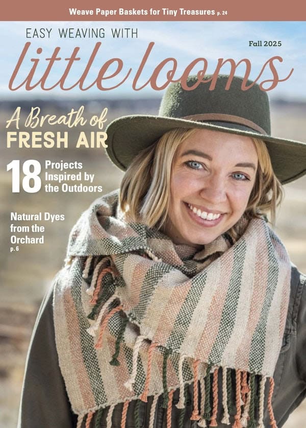 Cover of Little Looms Fall 2025 featuring a woman in a field wearing a felt hat and a handwoven striped scarf.