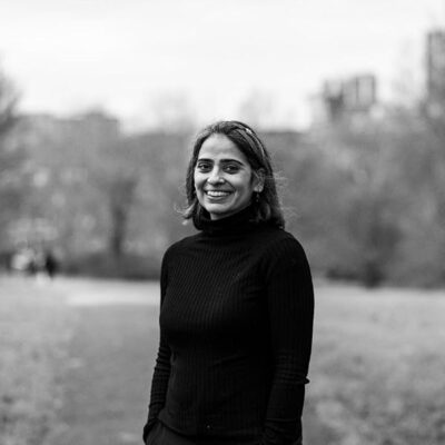 The Lights of Shantinagar by Nidhi Arora | A Thoughtful Family Saga with a Scientific Lens 6 Author Nidhi Arora, writer of The Lights of Shantinagar, in a B&W portrait photo.