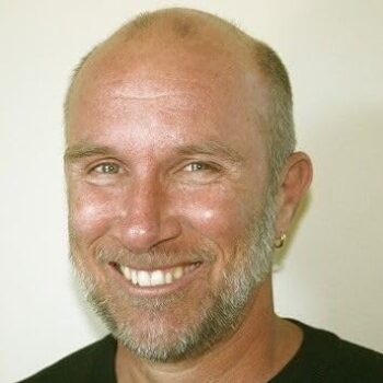 Tom Hogan Author Profile image, headshot with beige background