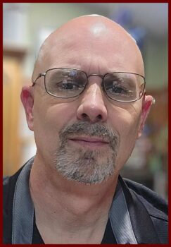 Gregory Armstrong Author profile image - headshot with goatee and glasses