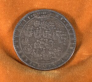 "Silver medal struck by Queen Elizabeth I after the defeat of the Spanish Armada, inscribed ‘Flavit Jehovah et Dissipati Sunt.’"