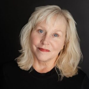 “Author portrait of Dr. Pam Stephens Lehenbauer, writer of Wonder and Joy for the Wired and Tired. Professional headshot with light blonde hair, black top, and neutral background.”
