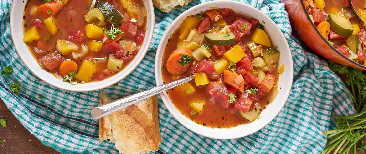 🪶 Friday Finds – 24 October 2025 | Indie Author E. Denise Billups, Bonsai Craft, & Fall Harvest Soup 33 Bowls of hearty vegetable soup filled with carrots, squash, zucchini, tomatoes, and herbs on a checkered teal towel with crusty bread on the side. Bright, cozy autumn meal setting.