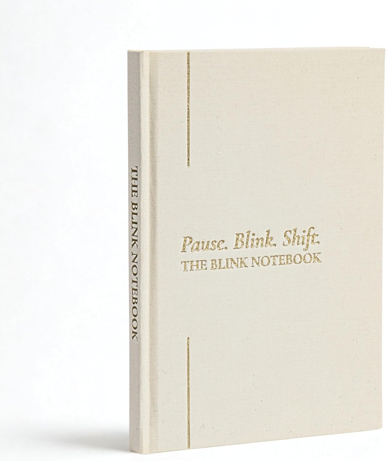 The Compassionate Writer by Anne E. Beall | Book Review + Guest Post 17 Minimalist hardcover journal titled Pause. Blink. Shift. The Blink Notebook. Features a cream-colored cover with subtle gold embossed text and thin gold vertical lines, photographed against a white background.