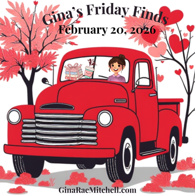 Square graphic for Gina's Friday Finds on February 20, 2026, featuring a red vintage pickup truck driven by a smiling woman, surrounded by pink trees and heart-shaped accents. Represents weekly curated finds shared on GinaRaeMitchell.com.