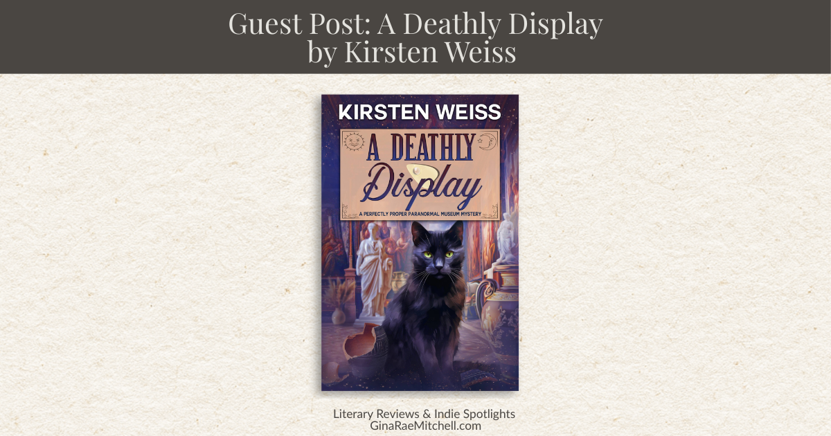Wide blog banner for guest post A Deathly Display by Kirsten Weiss featuring the mystery novel cover with a black cat inside a museum gallery framed by warm neutral tones and GinaRaeMitchell.com literary branding.