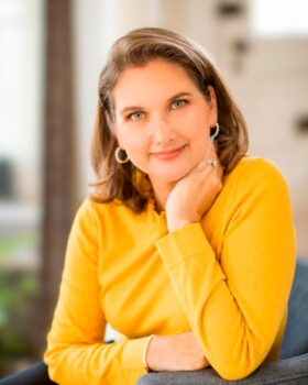 Author portrait of Kristine Delano, writer of the domestic suspense novel The Lies We Trade.