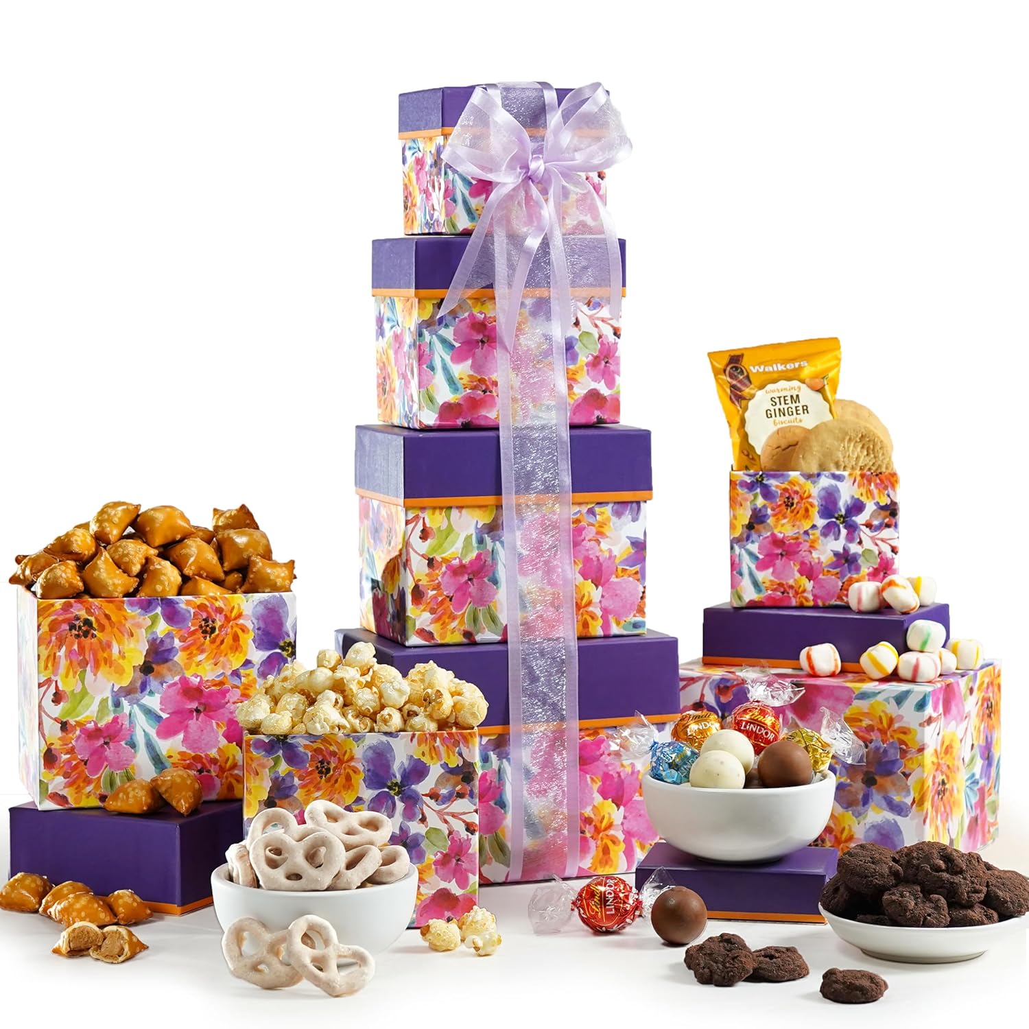 A tower of floral stacked boxes filled with delectable treats