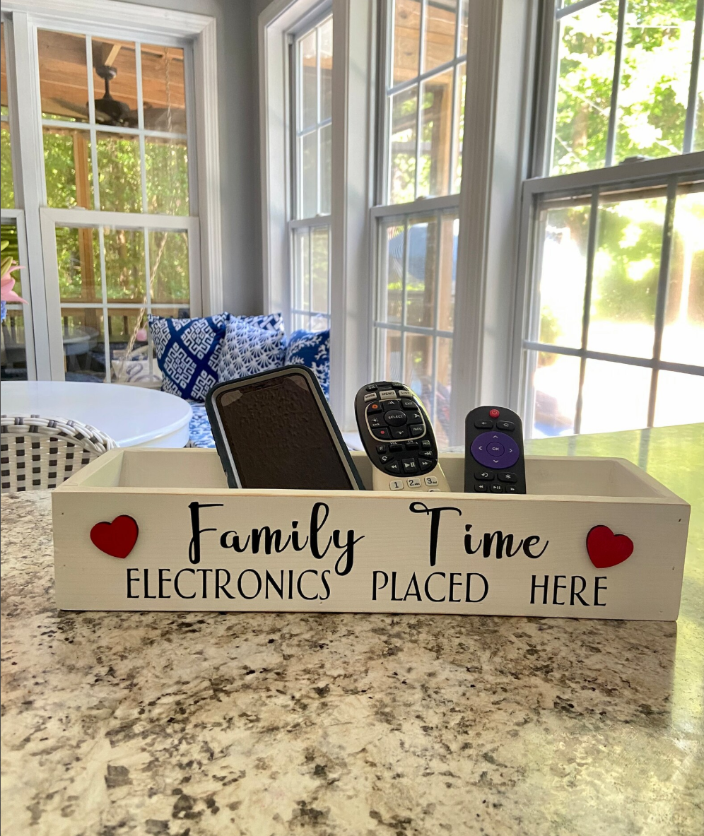 Handmade wooden family time box designed to hold phones and electronics, encouraging device-free time together.