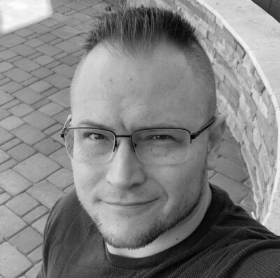 Black and white author headshot of Thomas Howard Riley