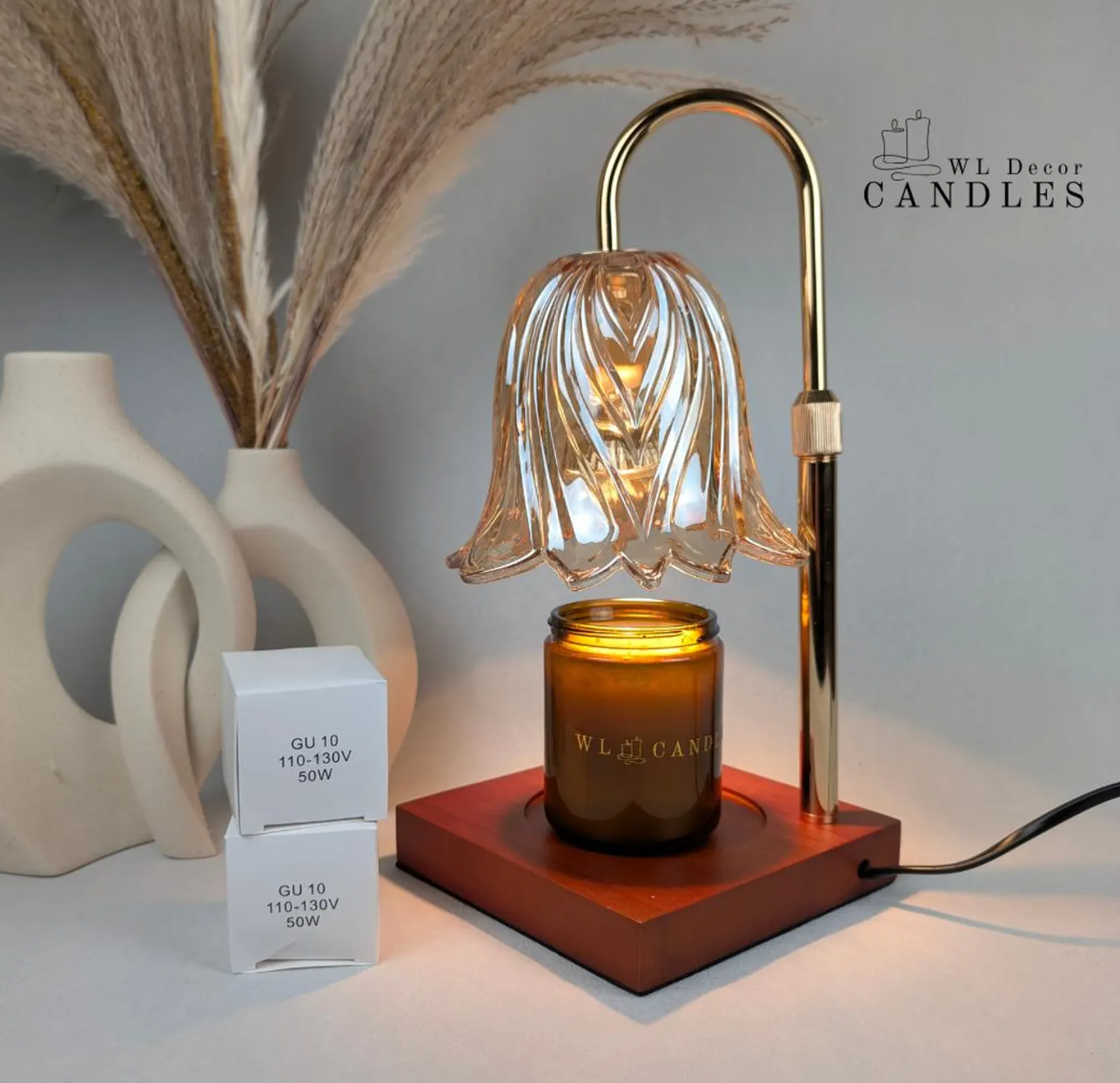 Electric candle warmer lamp with amber jar candle creating a soft, flameless glow for a cozy reading space