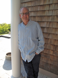 For She Had Eyes by Seth Margolis | Psychological Suspense Review & Guest Post 2 Author Seth Margolis standing outdoors beside a white column wearing glasses and a light striped button-down shirt.