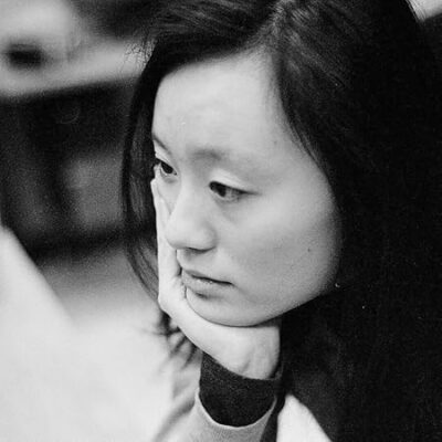 Y. R. Liu author profile black + white image of author cupping her chin and looking thoughtfully to the side