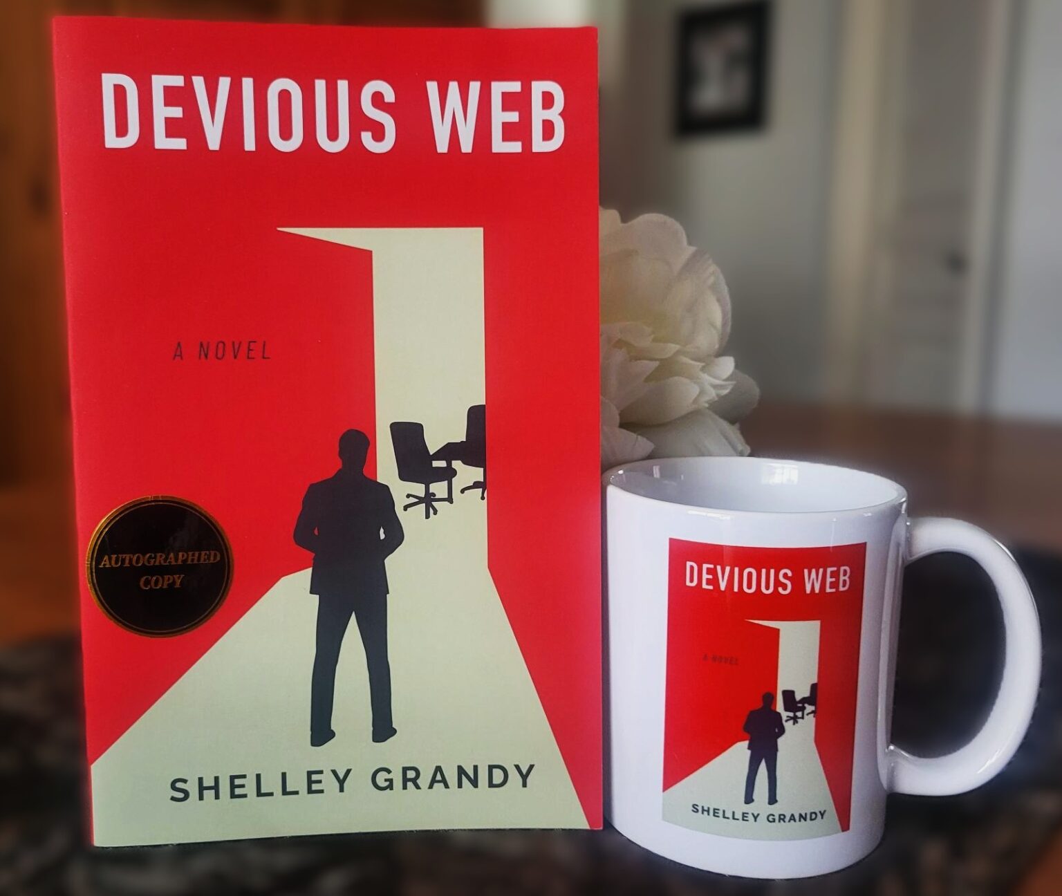 Giveaway graphic for Devious Web featuring a signed book and matching mug.