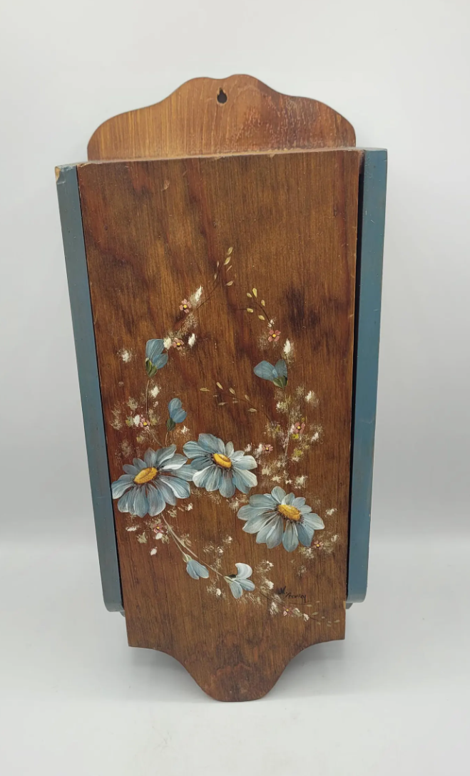 Vintage-inspired wooden wall-mounted recipe holder hand-painted with soft blue flowers.