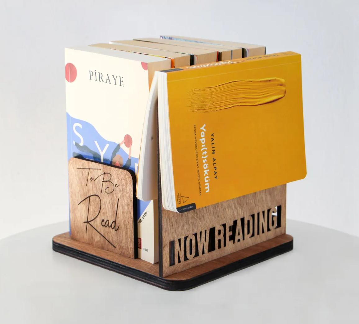 Wooden tabletop book holder designed to keep your next books nearby for easy reading access.