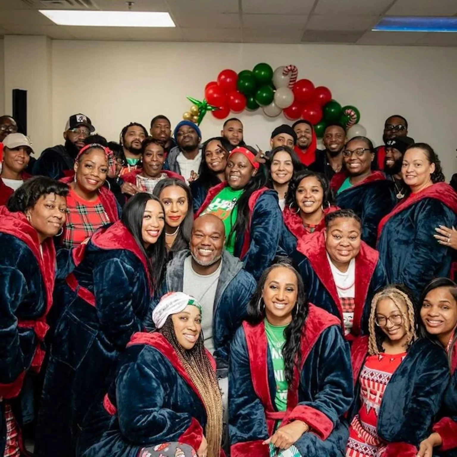 A festive family gathering with everyone wearing matching hooded spa robes.