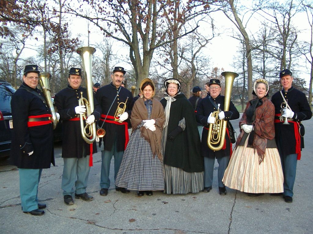 M.F. Jones and her husband Doug Hedwig with members and companions of the Federal City Brass Band in Civil War-era clothing.